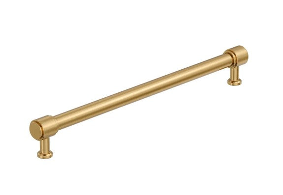 A single long cabinet pull handle with a brushed gold finish, shown diagonally on a plain white background.